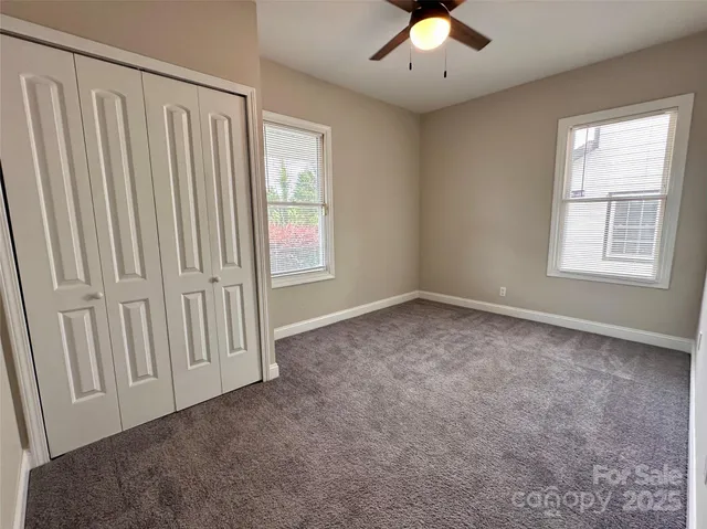 an empty room with a empty space and windows