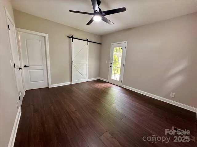 a bathroom with a granite countertop toilet a sink and a bathtub