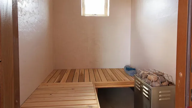 a view of a livingroom with furniture and staircase