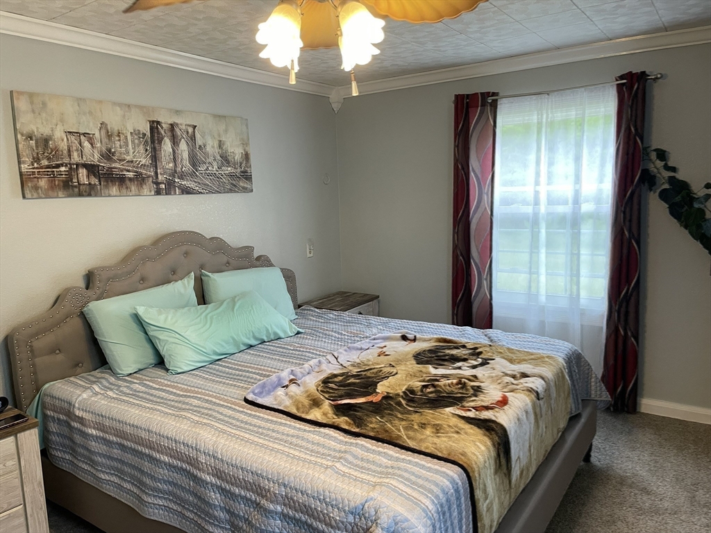 190 Turners Falls Road Montague, MA 01351 - Photo 17 of 35 a bedroom with a bed and a painting on the wall
