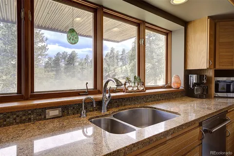 a kitchen with a sink and a window