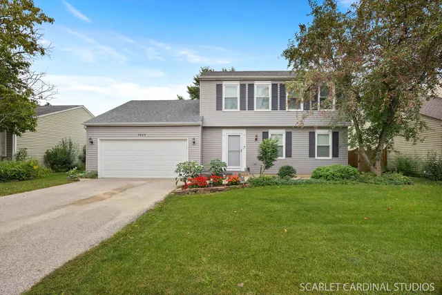 a front view of a house with a garden and porch