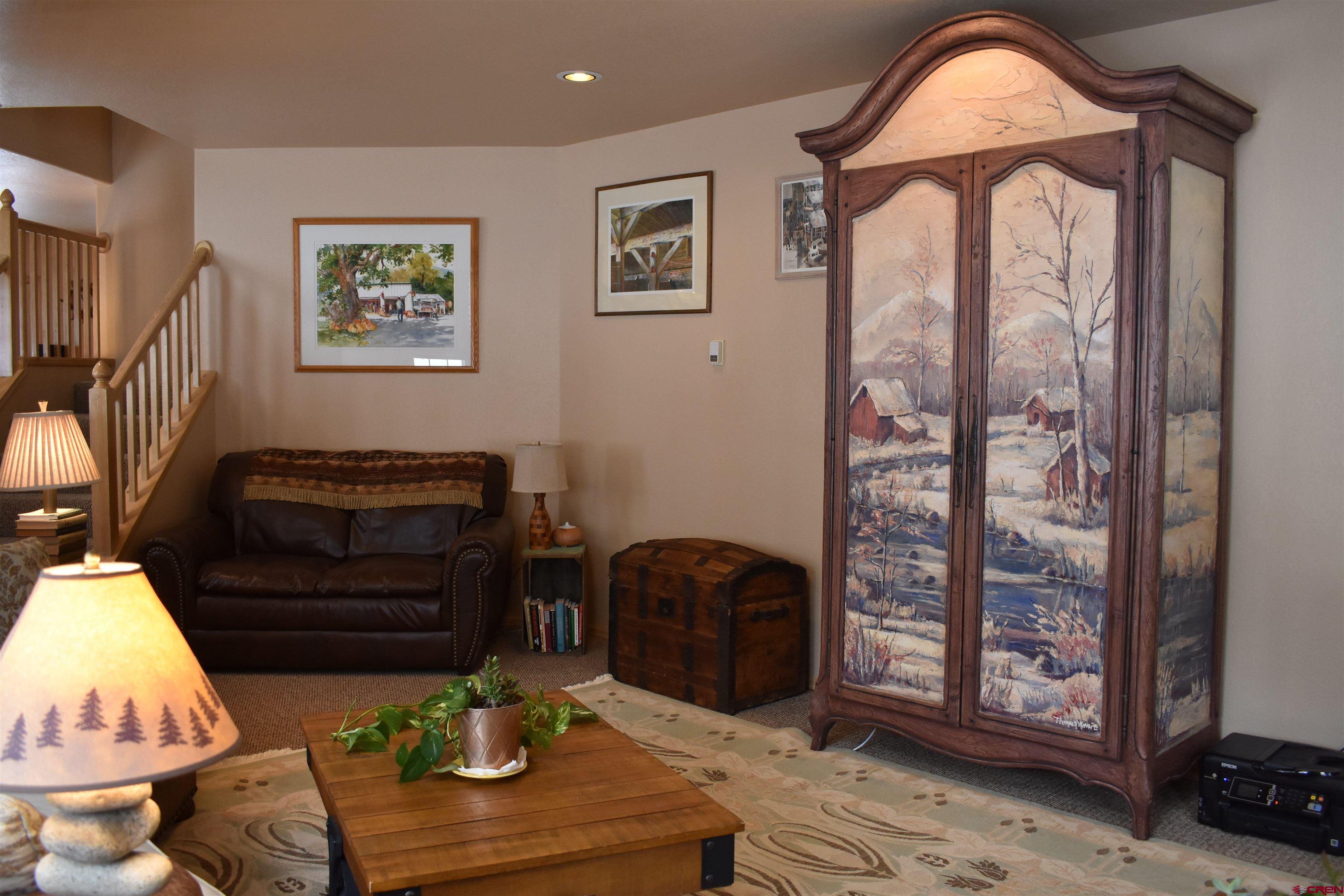 1570 Oak Street Ouray, CO 81427 - Photo 11 of 35 a living room with furniture a rug and a window