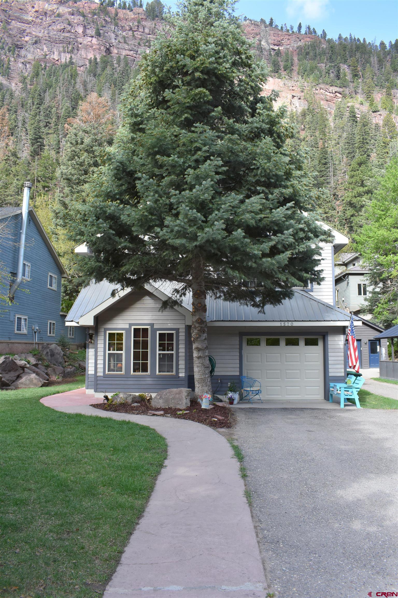 1570 Oak Street Ouray, CO 81427 - Photo 2 of 35 front view of a house with a yard