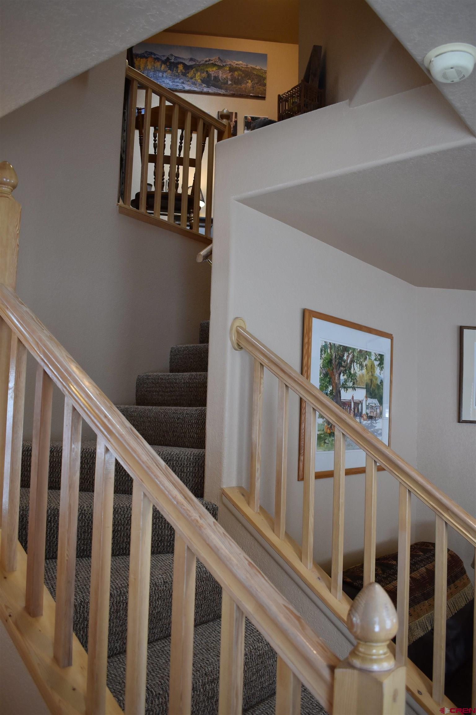 1570 Oak Street Ouray, CO 81427 - Photo 21 of 35 a view of staircase with railing and white walls