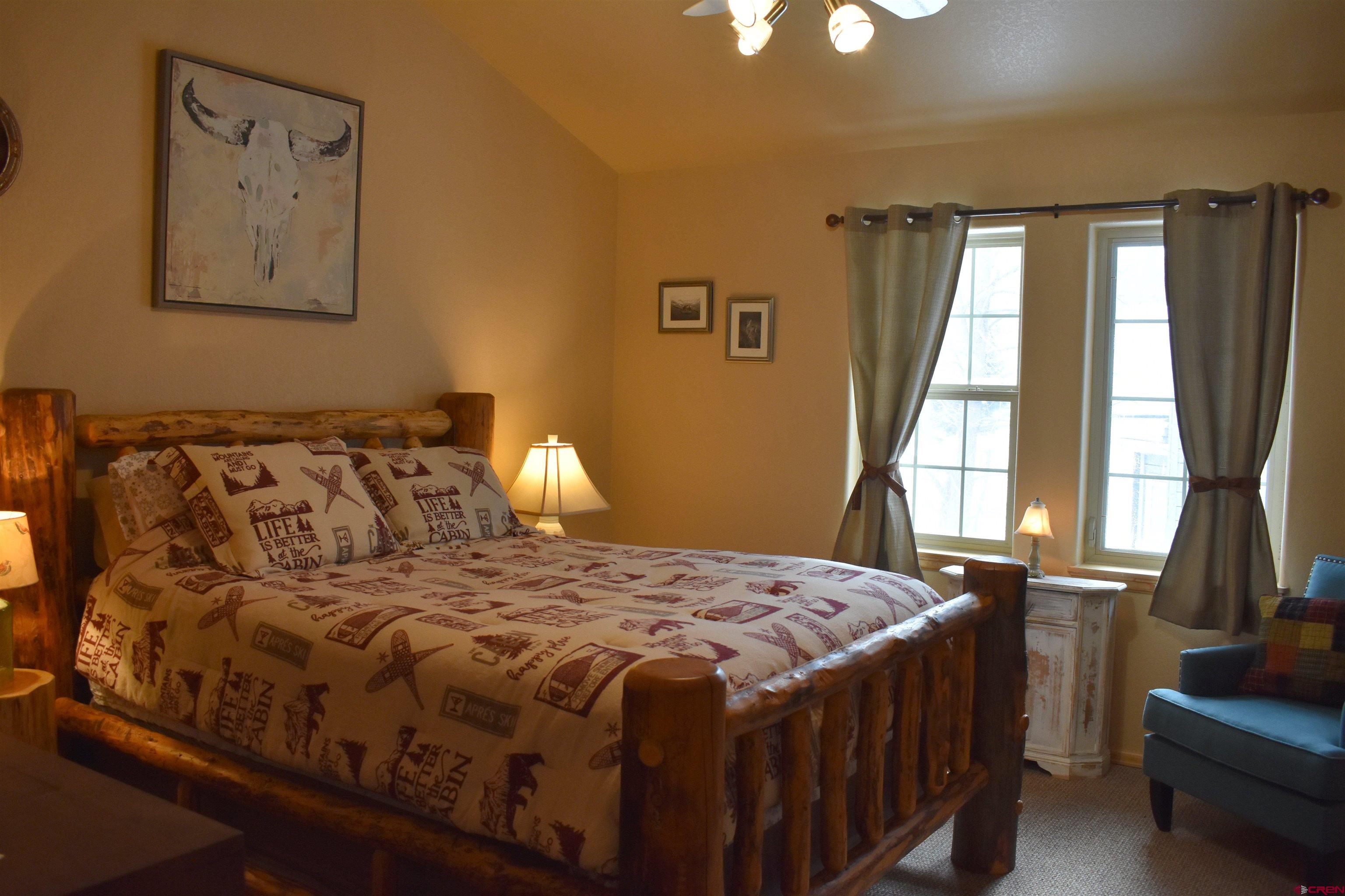 1570 Oak Street Ouray, CO 81427 - Photo 26 of 35 a bedroom with a bed and a large window