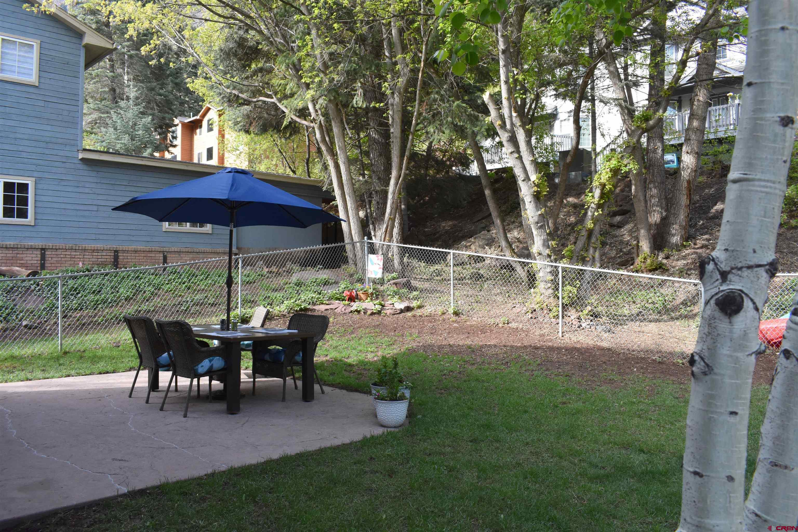 1570 Oak Street Ouray, CO 81427 - Photo 34 of 35 a view of a wooden deck with chairs and a yard