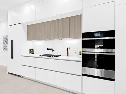 a kitchen with stainless steel appliances a stove and a refrigerator