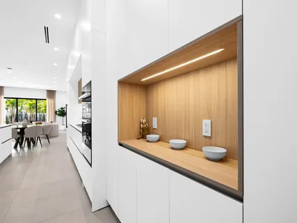 a spacious bathroom with a granite countertop sink and a large mirror