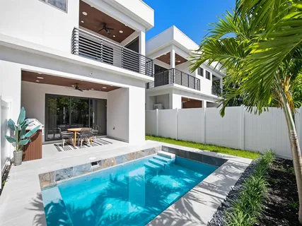 a kitchen with a stove and a dining table