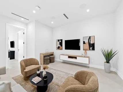 a balcony with table and chairs