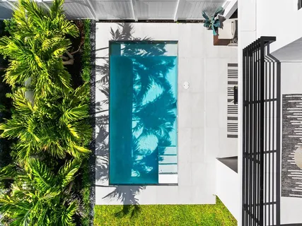 a bathroom with a double vanity sink and mirror