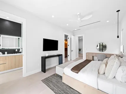 a bathroom with a double vanity sink and mirror