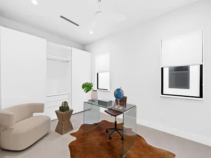 a picture of a room with a white wall and a picture