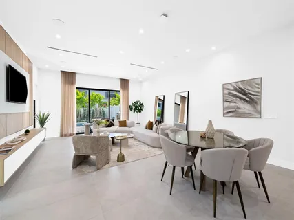 a view of a livingroom with furniture window and wooden floor