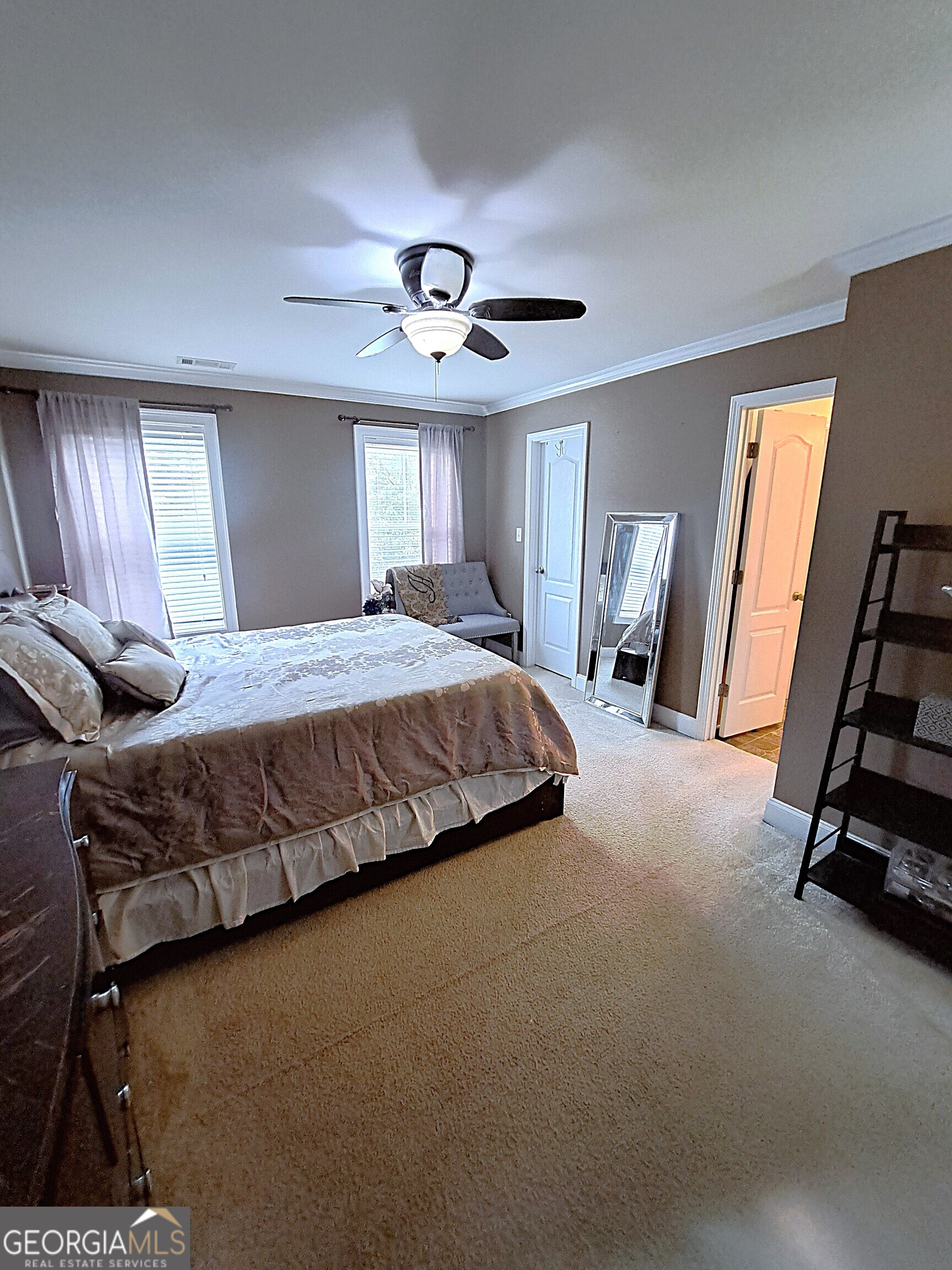 533 Edgewood Drive Athens, GA 30606 - Photo 11 of 20 a bedroom with a bed and a chandelier