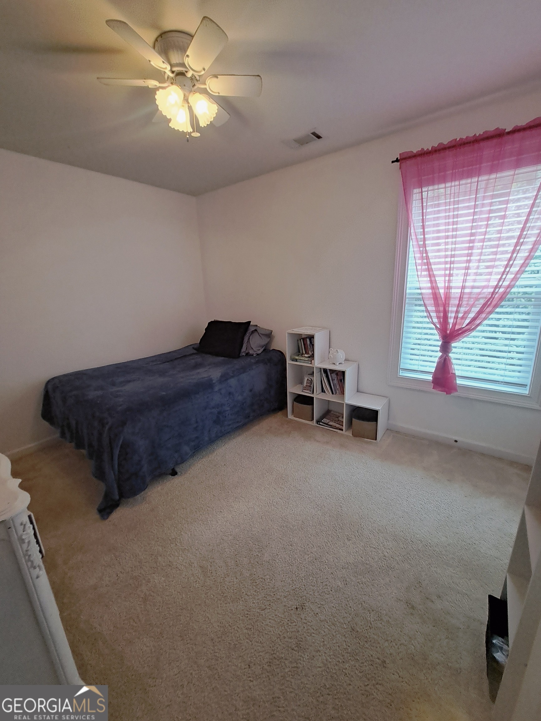 533 Edgewood Drive Athens, GA 30606 - Photo 16 of 20 a living room with a bed furniture and a large window