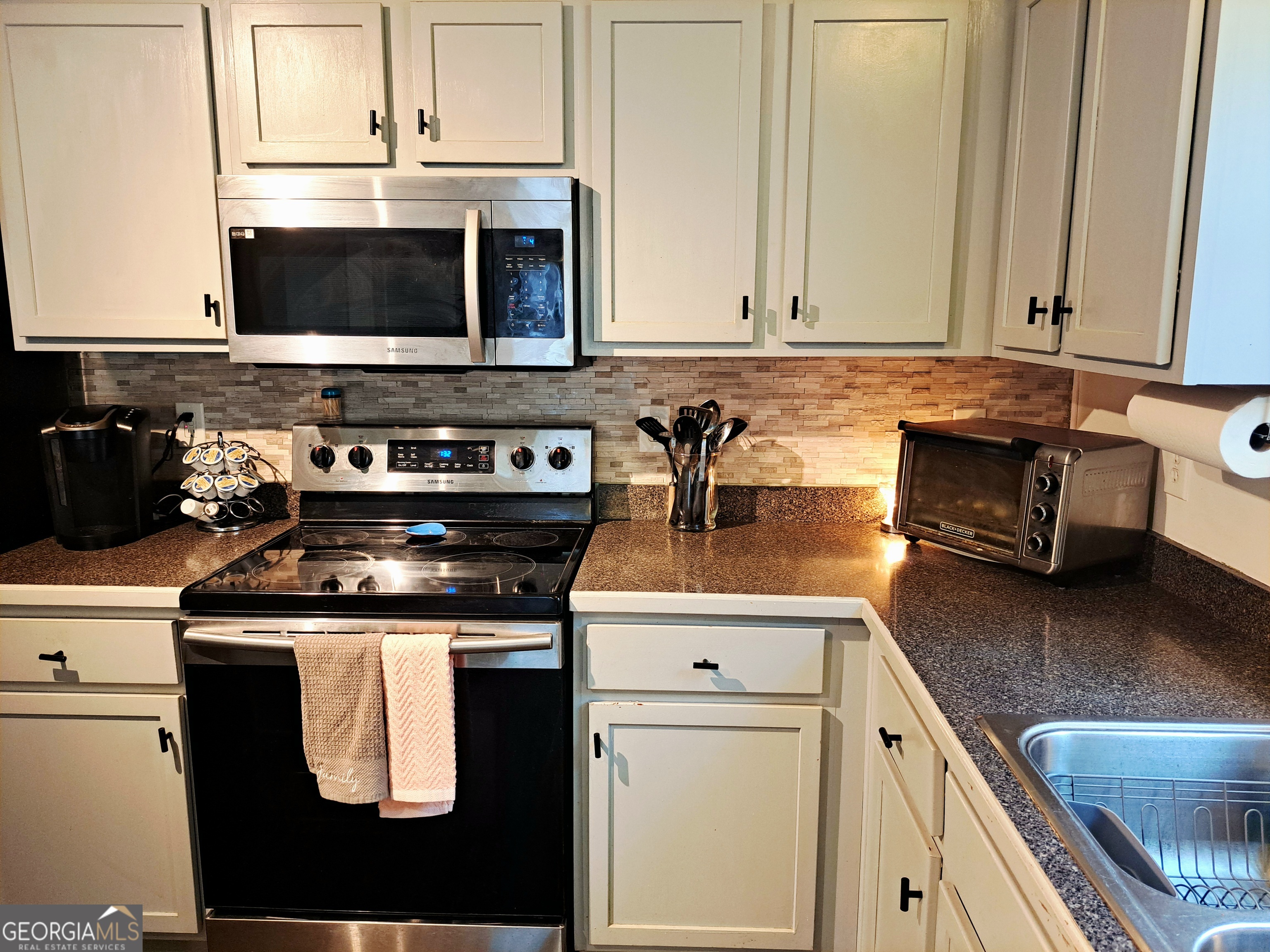 533 Edgewood Drive Athens, GA 30606 - Photo 5 of 20 a kitchen with stainless steel appliances granite countertop a stove a microwave and oven