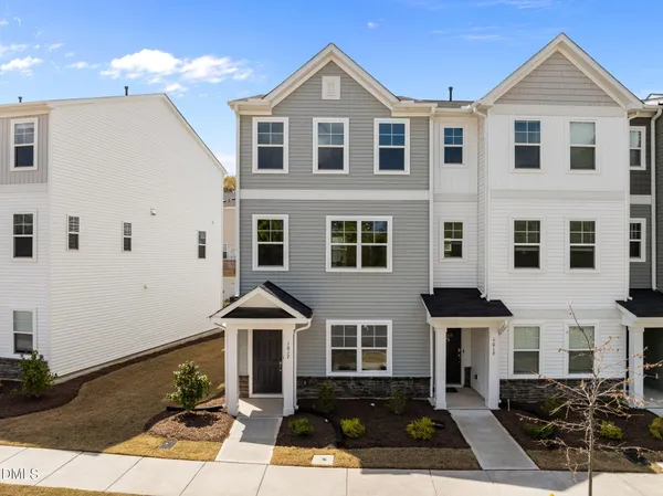 a front view of a house with yard