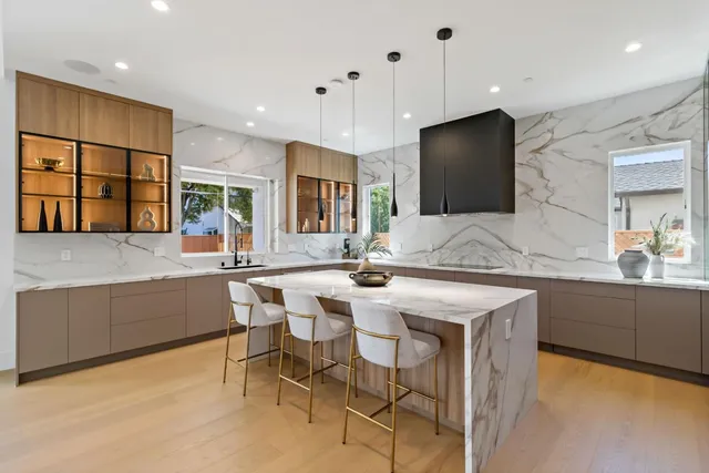 a bedroom with a bed a couch and dresser