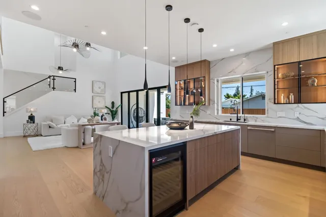 a bathroom with a sink a large mirror and a shower