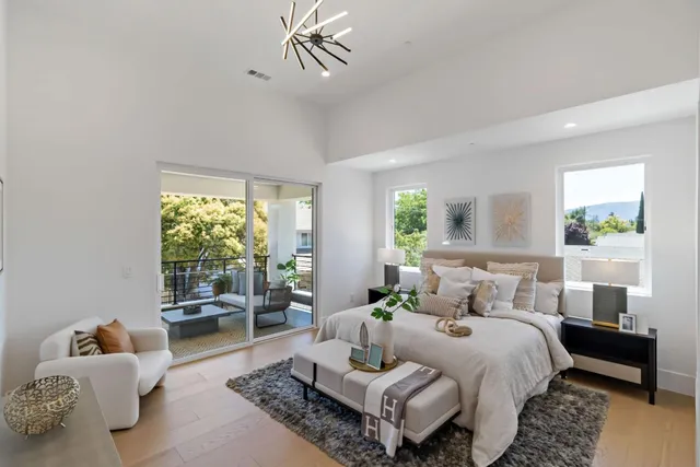 a bedroom with a bed and a lamp