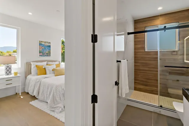 a living room with furniture and a floor to ceiling window