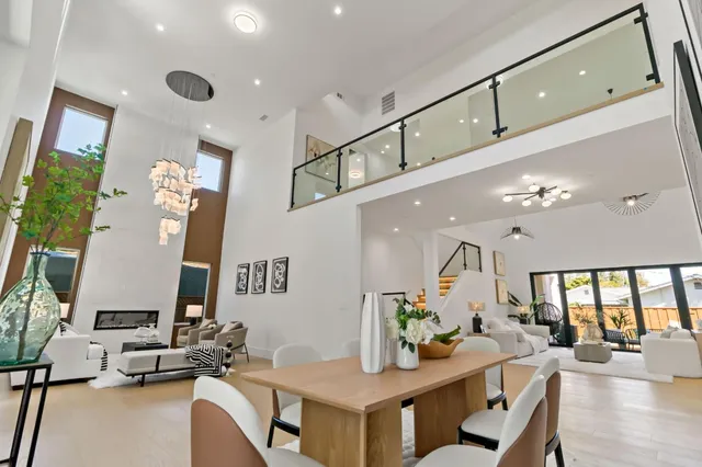 a living room with furniture and a painting