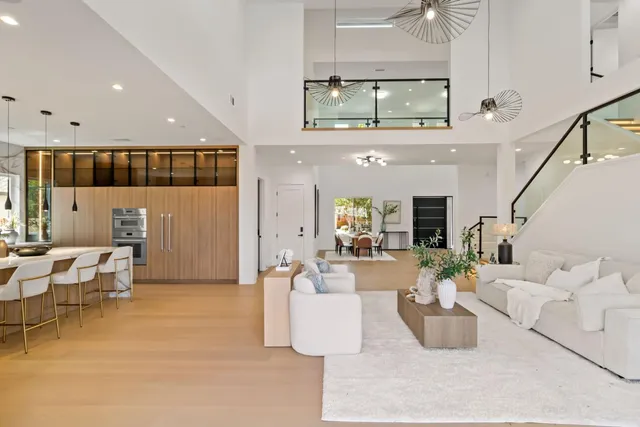 a view of a livingroom with furniture and staircase