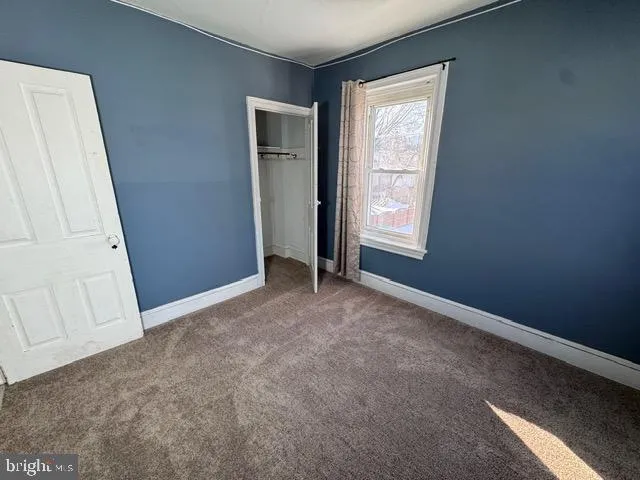 a bathroom with a sink mirror and toilet