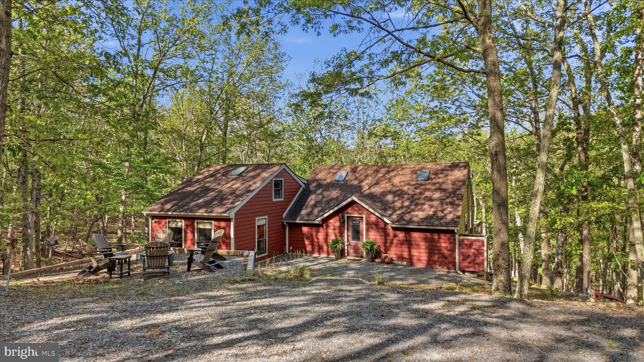 1856 Crossings View Road Paw Paw, WV 25434 - Photo 40 of 45 a view of a big house with large trees and plants