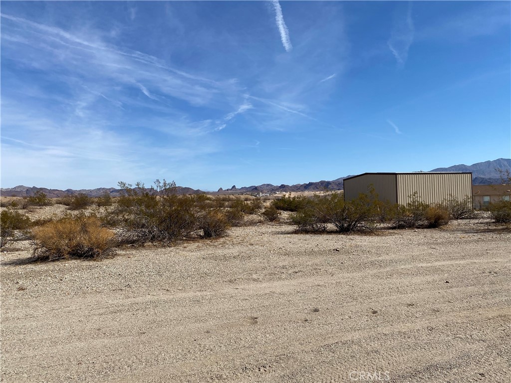 0 Lot 1 On Desert View Needles, CA 92363 - Photo 9 of 18 a view of a dry yard with mountain