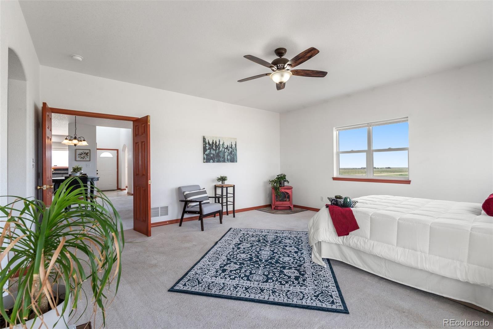 11424 McKissick Road Peyton, CO 80831 - Photo 11 of 32 a living room with furniture and a rug
