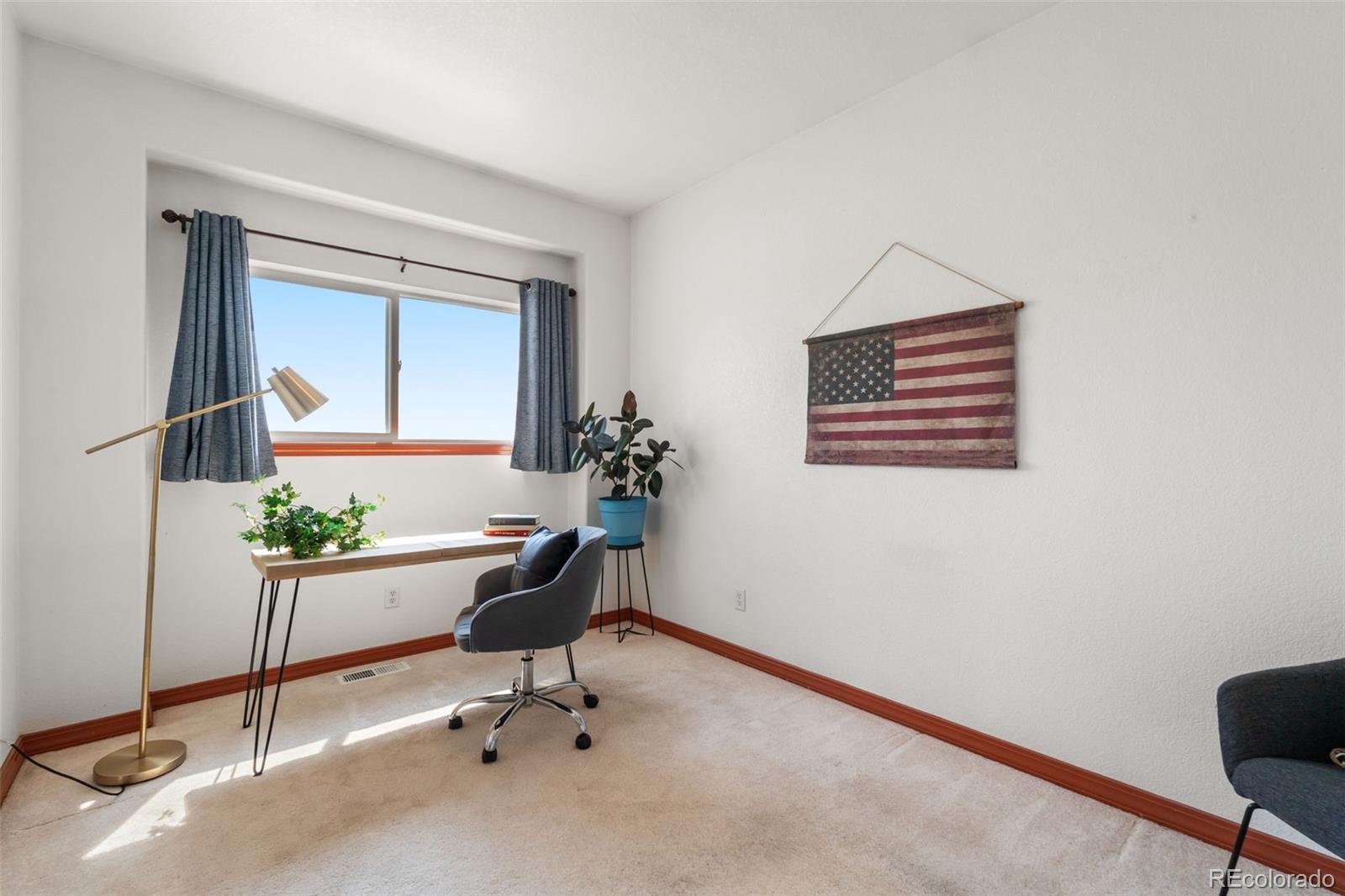 11424 McKissick Road Peyton, CO 80831 - Photo 14 of 32 a view of a workspace with a window and chair