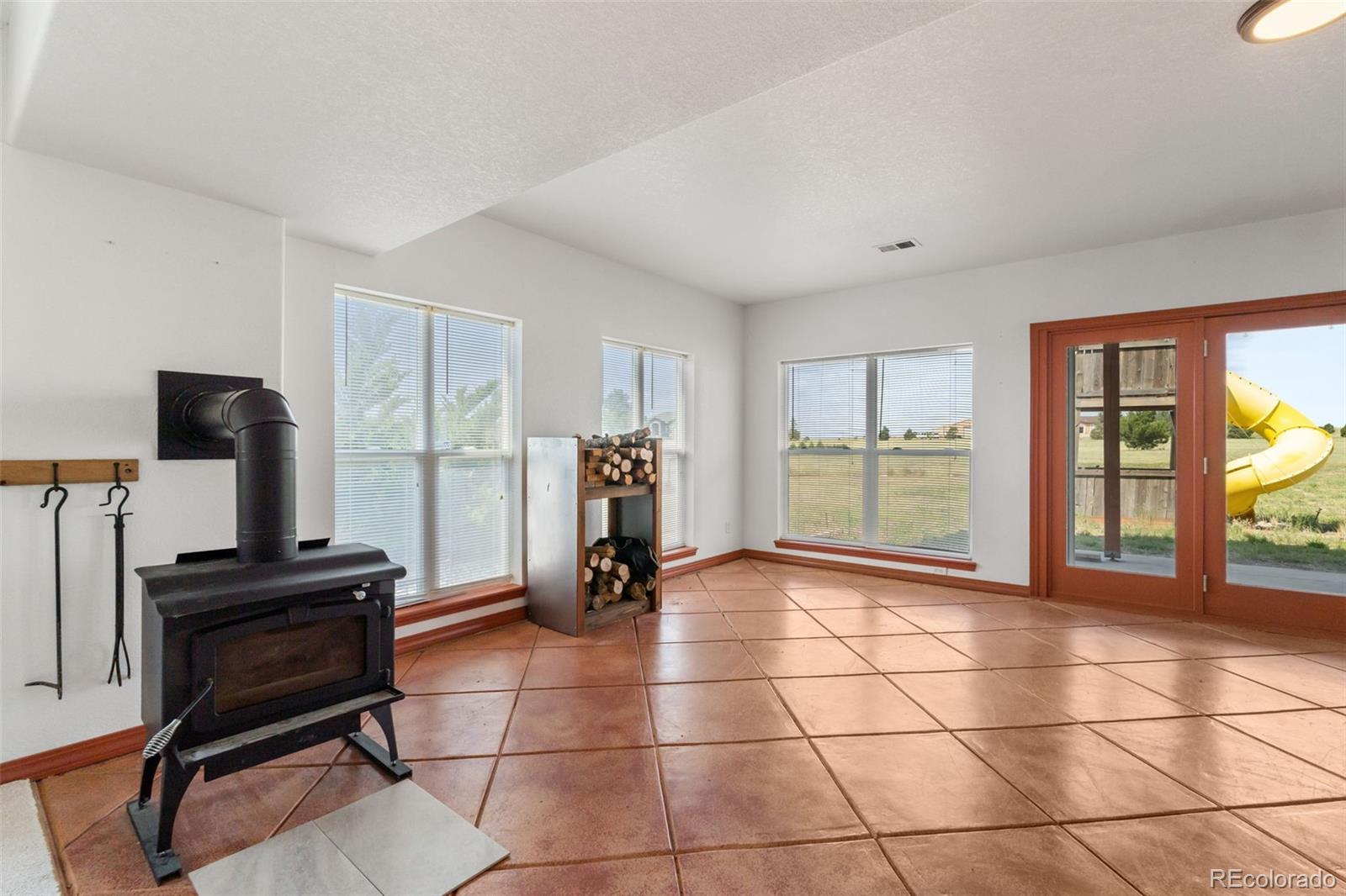 11424 McKissick Road Peyton, CO 80831 - Photo 20 of 32 a view of a livingroom with workspace and a window