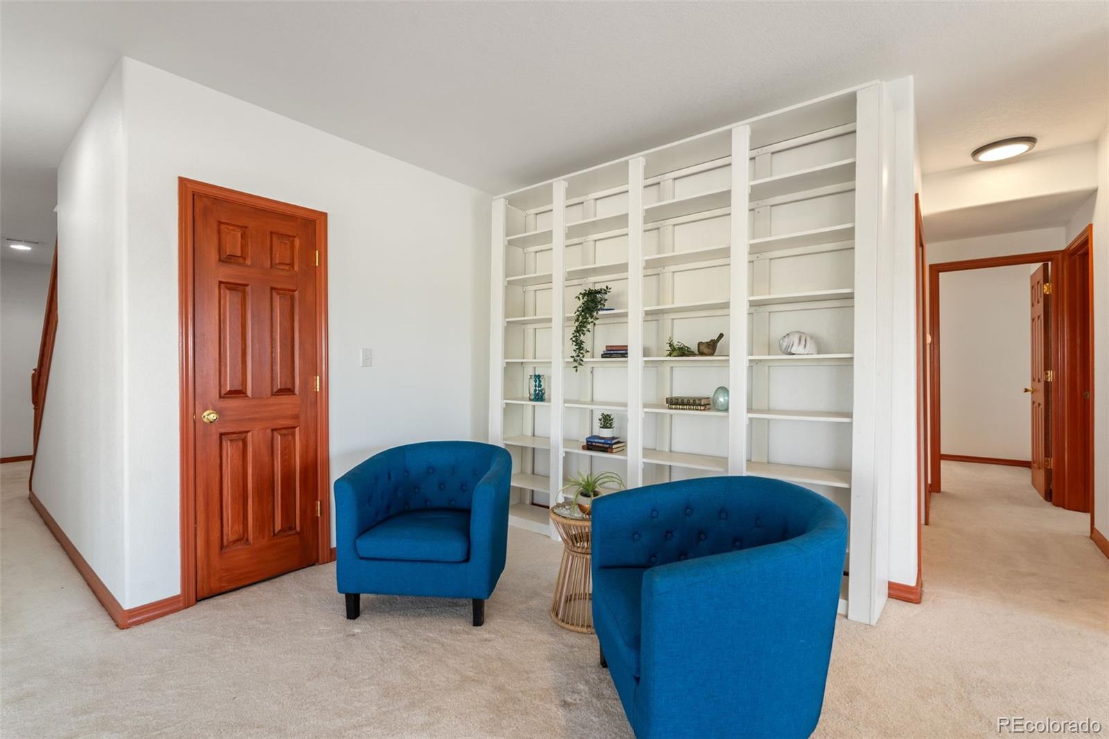 11424 McKissick Road Peyton, CO 80831 - Photo 23 of 32 a living room with furniture and a closet