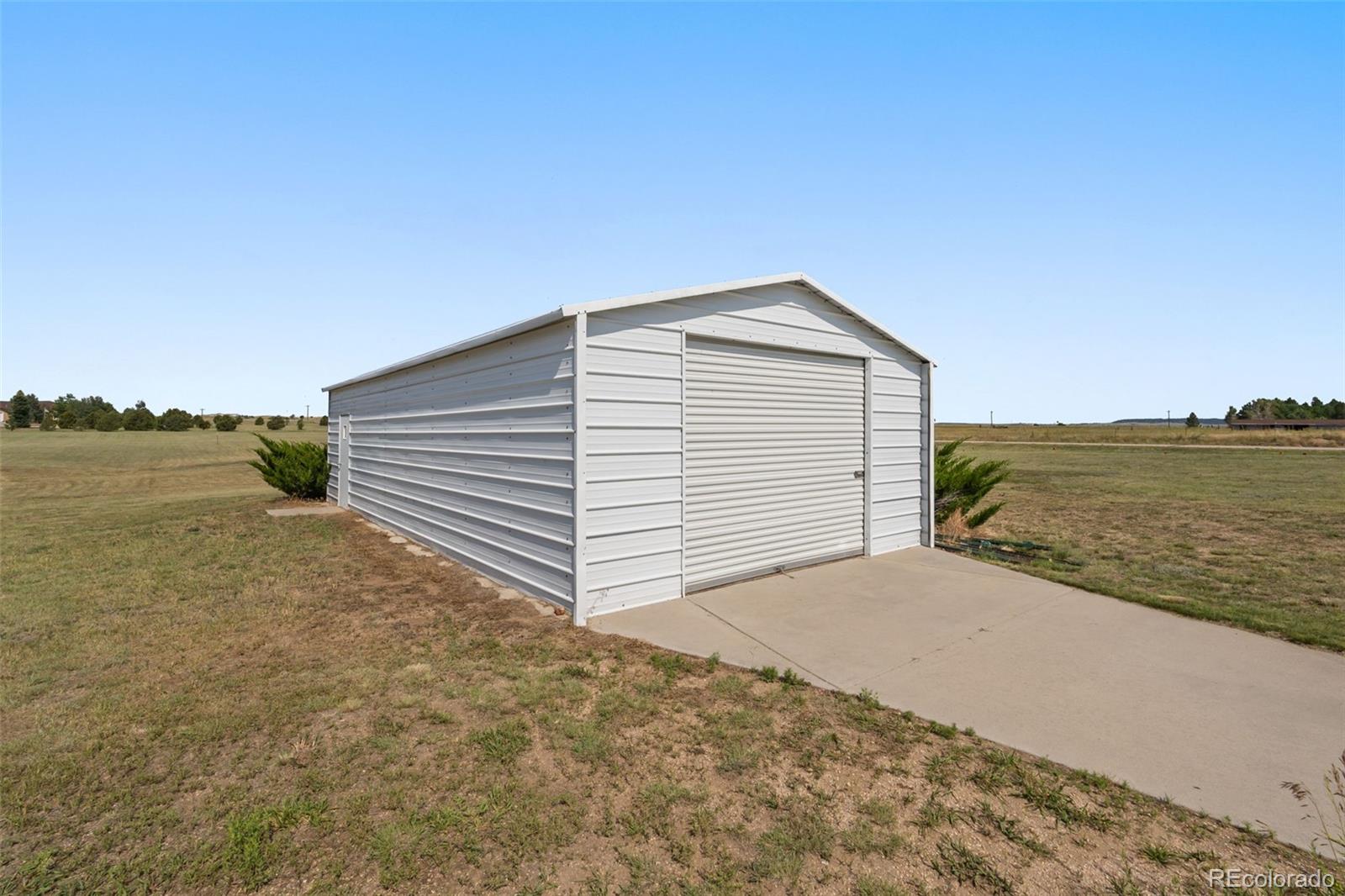 11424 McKissick Road Peyton, CO 80831 - Photo 30 of 32 a view of ocean with beach