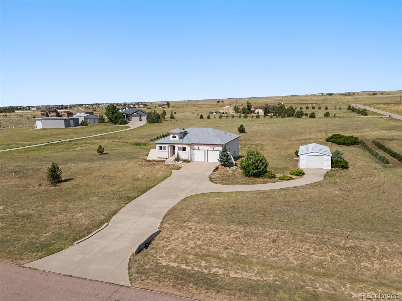 11424 McKissick Road Peyton, CO 80831 - Photo 32 of 32 an aerial view of a house with a ocean view