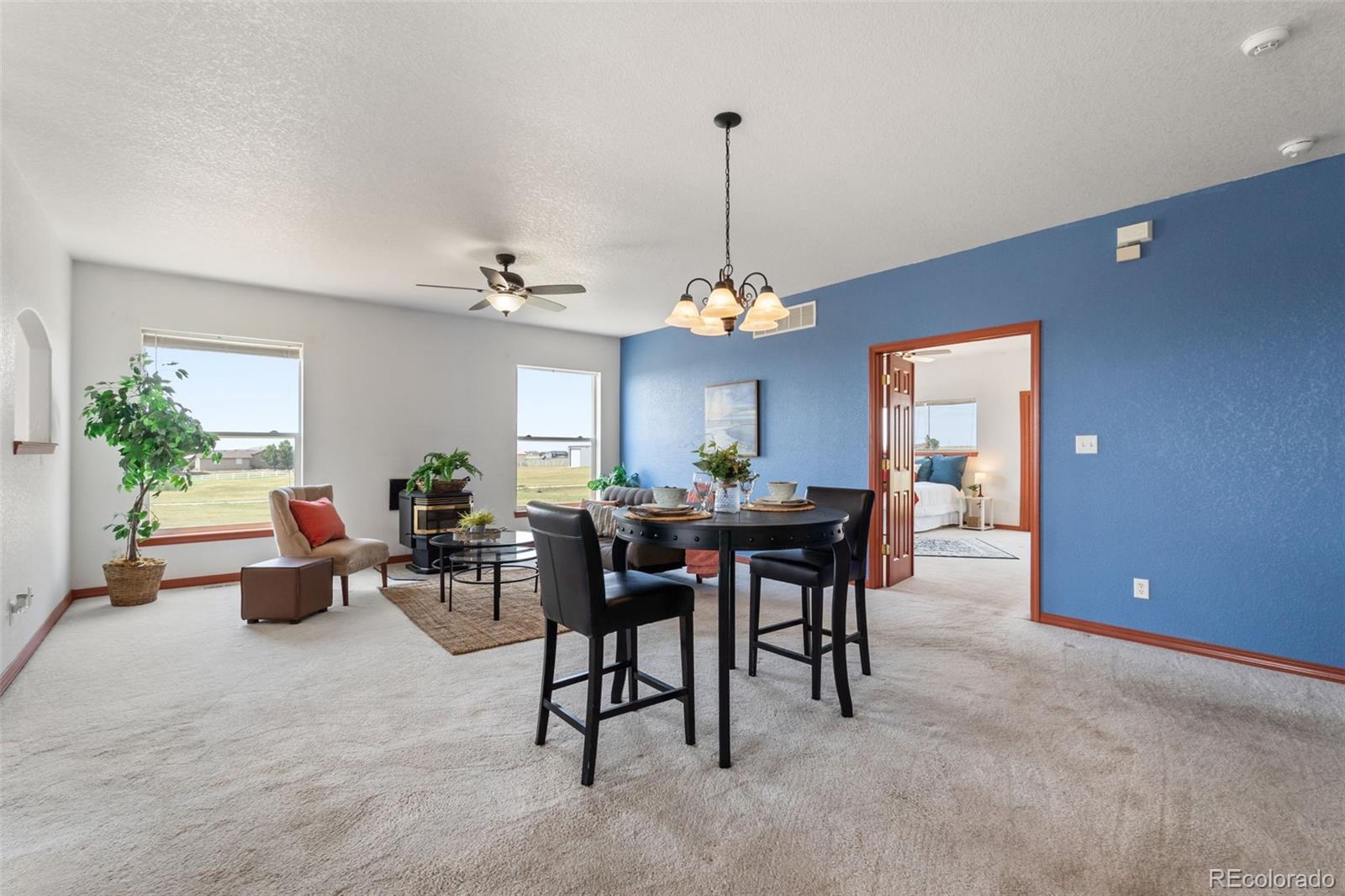 11424 McKissick Road Peyton, CO 80831 - Photo 4 of 32 a view of a dining room with furniture and window