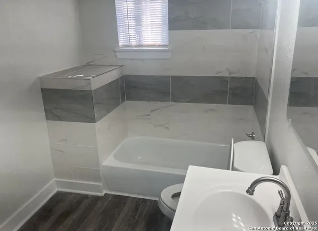 a bathroom with a sink and bathtub