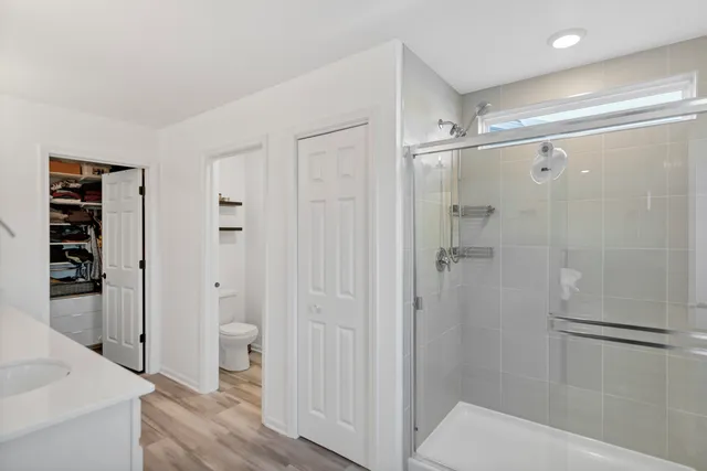 a bathroom with a shower and a sink