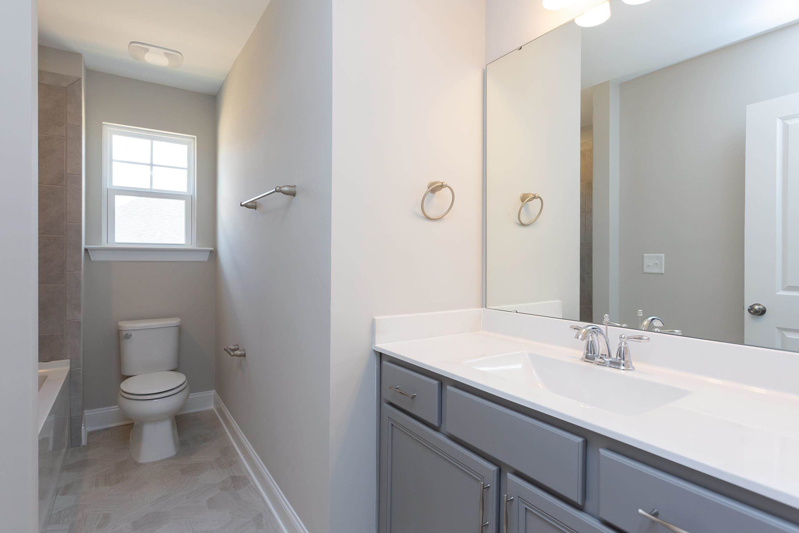 716 Virgil Road Durham, NC 27703 - Photo 11 of 14 a bathroom with a sink toilet and shower