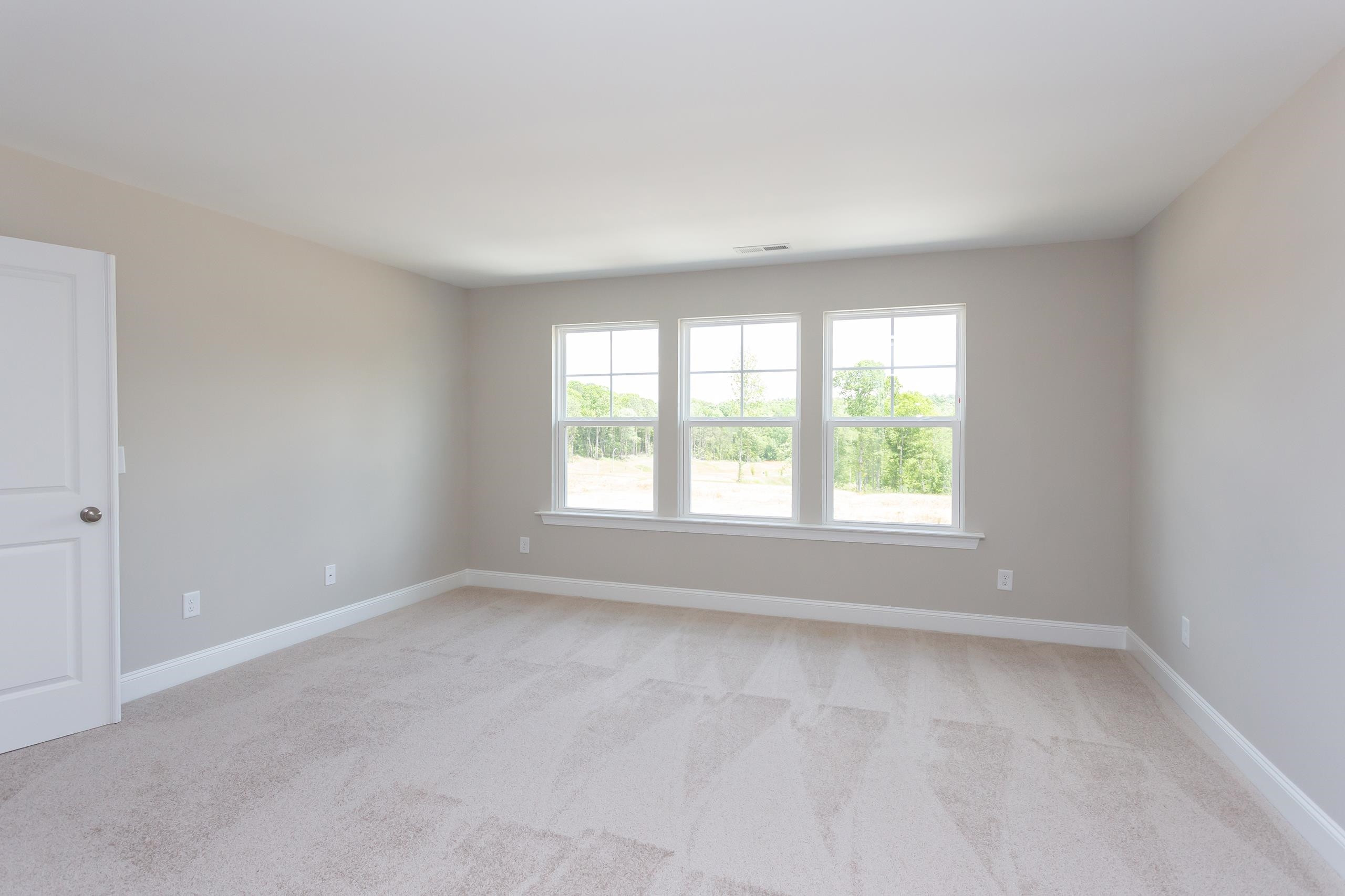 716 Virgil Road Durham, NC 27703 - Photo 6 of 14 an empty room with a window