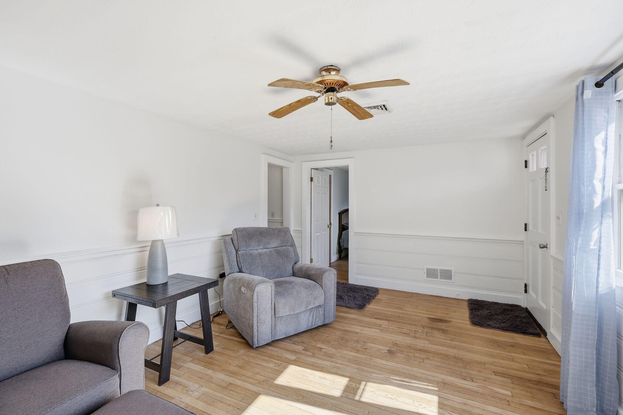 26 Howes Road South Yarmouth, MA 02664 - Photo 12 of 42 a living room with furniture and a wooden floor