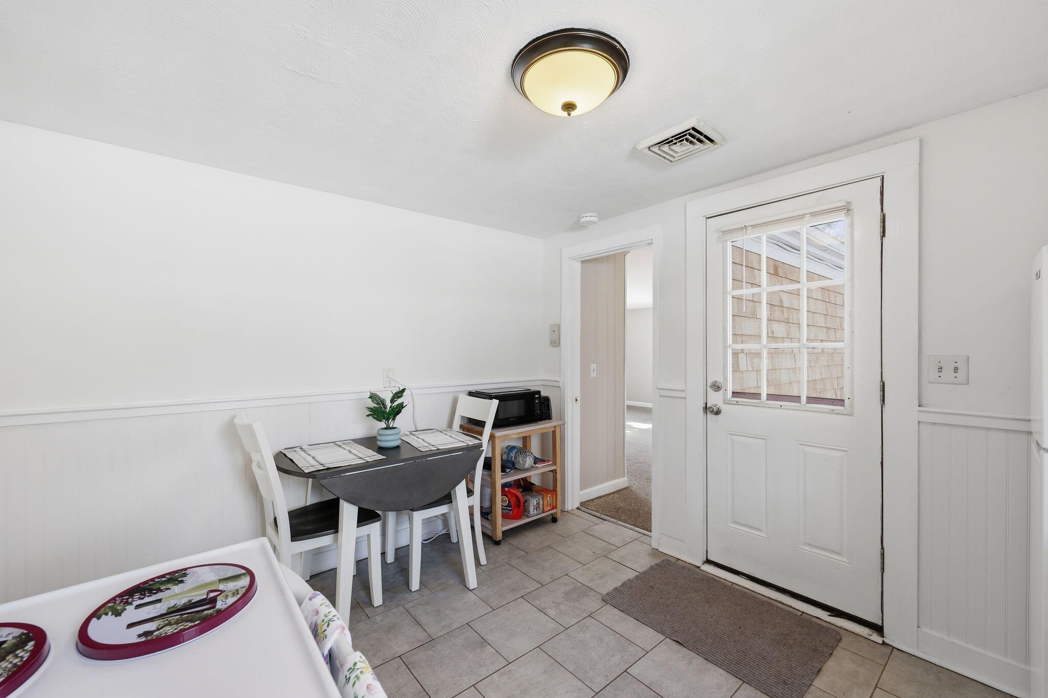 26 Howes Road South Yarmouth, MA 02664 - Photo 18 of 42 a view of a dining room with furniture and a table