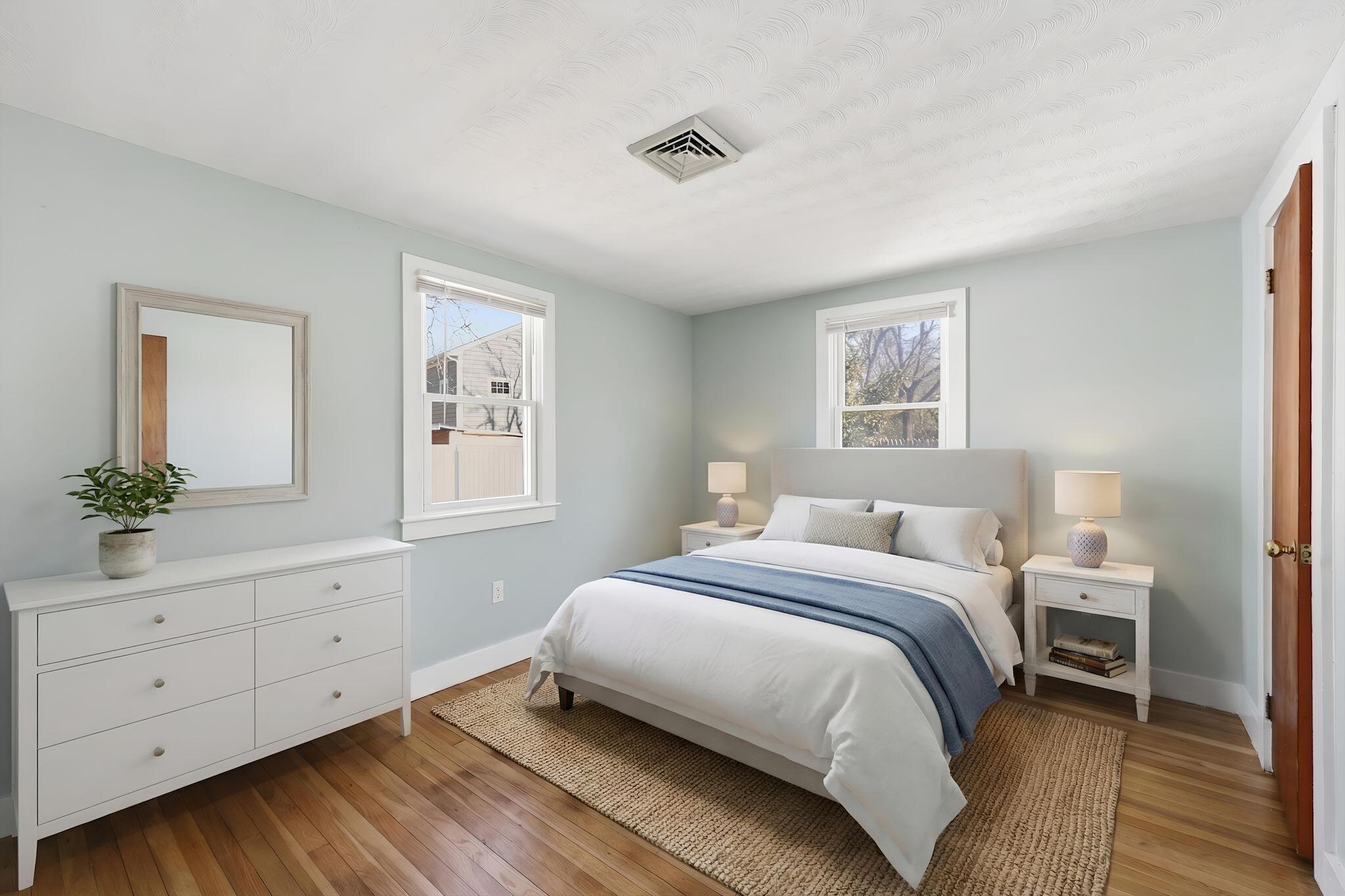 26 Howes Road South Yarmouth, MA 02664 - Photo 26 of 42 a bedroom with a bed and a potted plant on dresser