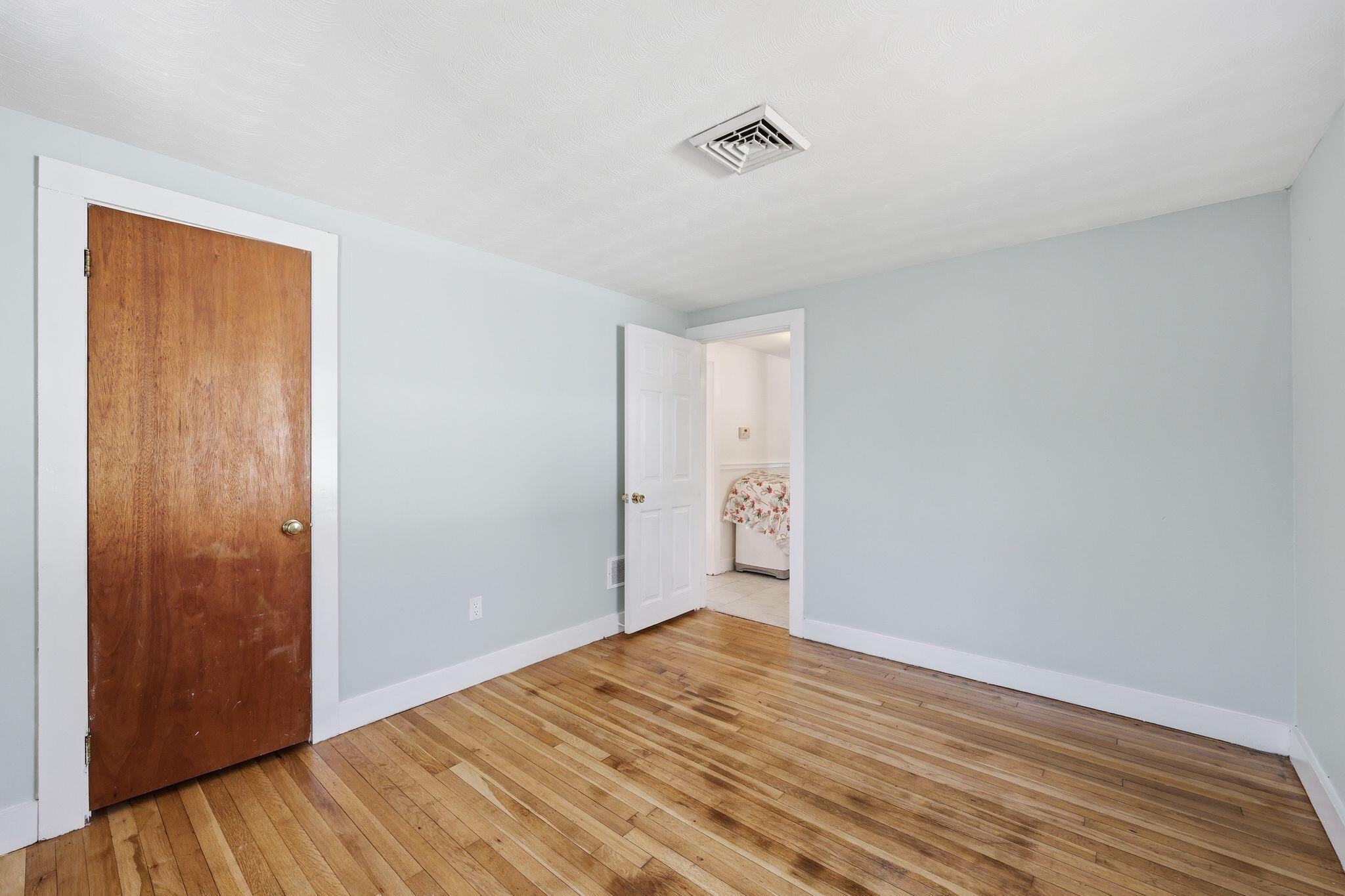 26 Howes Road South Yarmouth, MA 02664 - Photo 28 of 42 a view of empty room with wooden floor