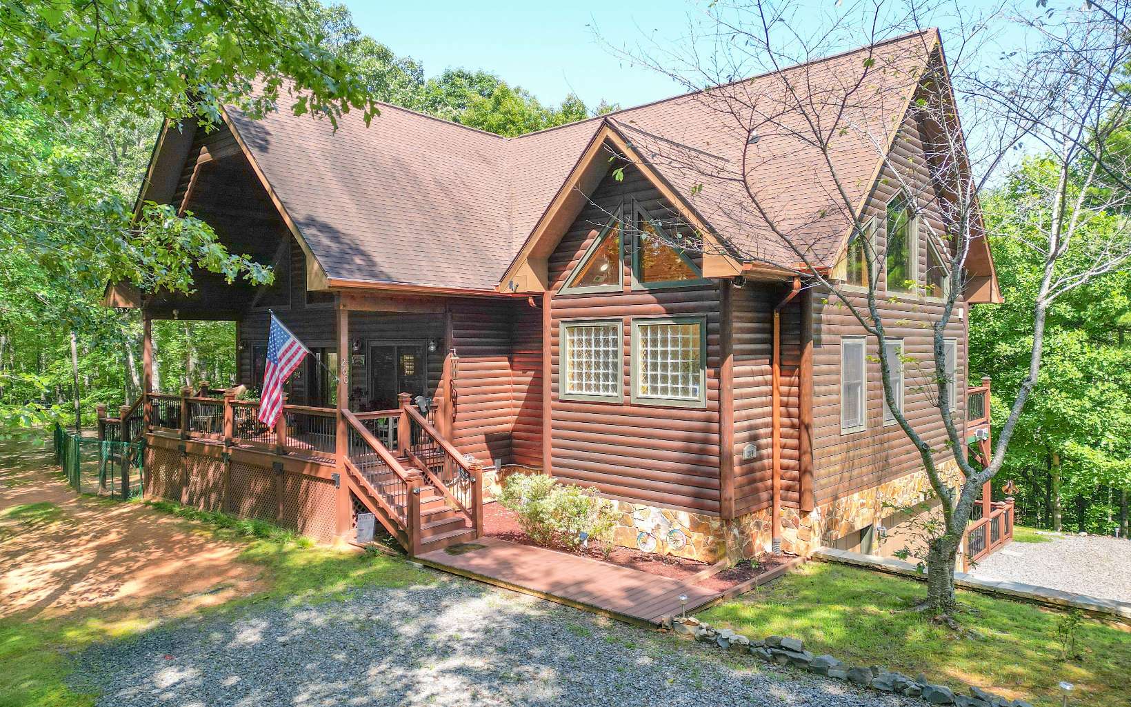 260 Berry Hl Road Murphy, NC 28906 - Photo 1 of 55 a front view of a house with garden