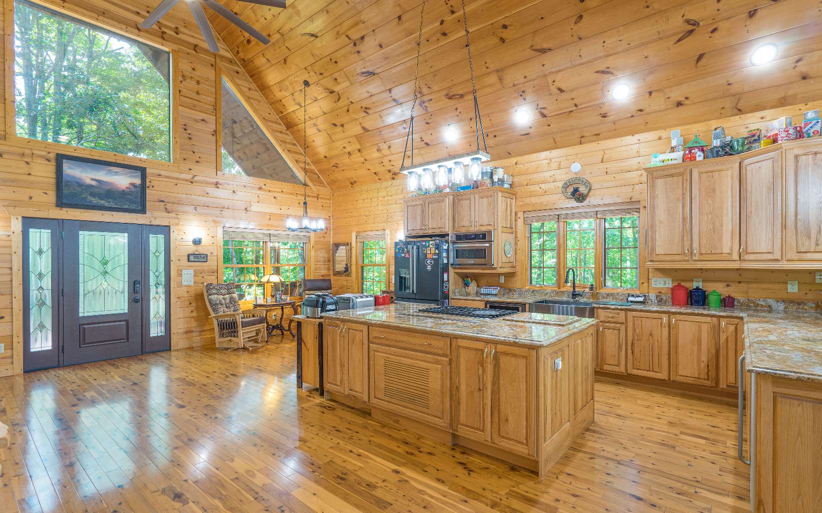 260 Berry Hl Road Murphy, NC 28906 - Photo 11 of 55 a kitchen with a stove a refrigerator and wooden cabinets