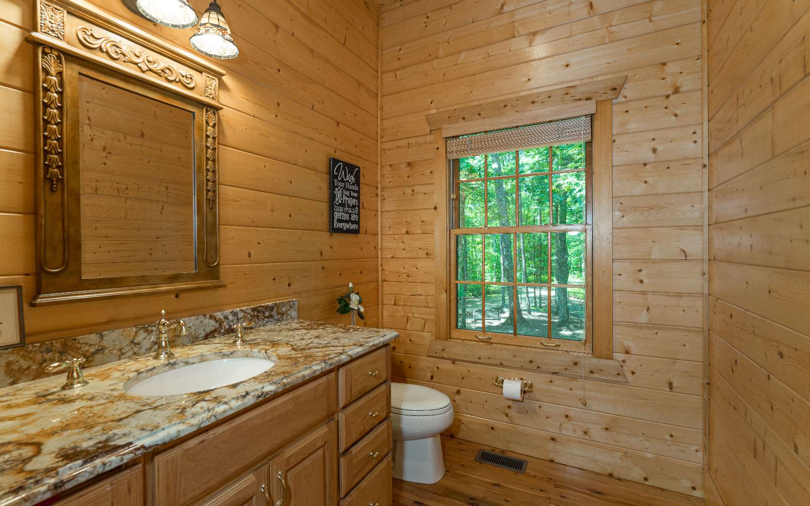 260 Berry Hl Road Murphy, NC 28906 - Photo 20 of 55 a bathroom with a granite countertop toilet a sink and mirror